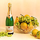 Bottle of Champage and bowl of fruit